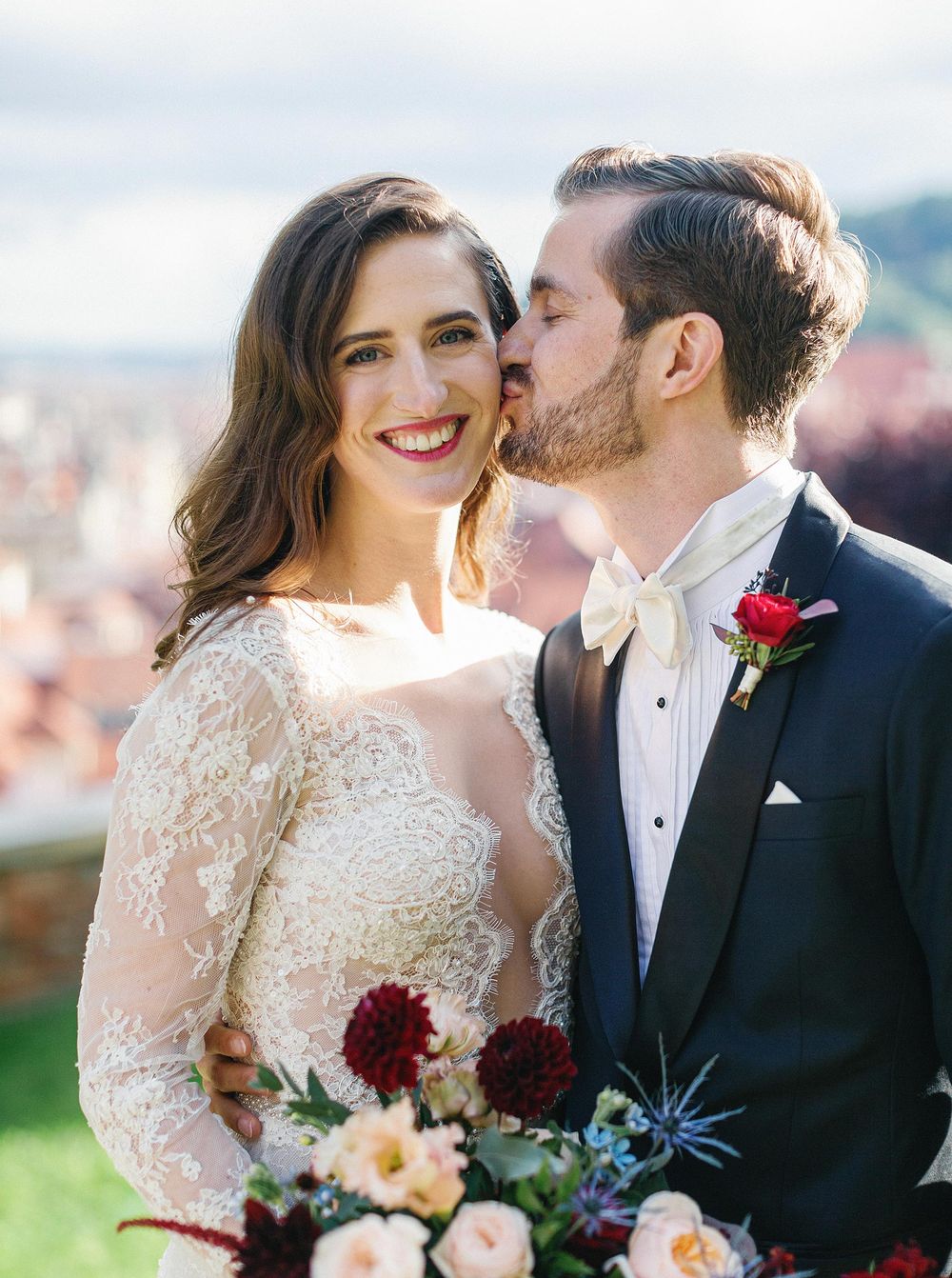 Romantic moment between newly married couple in Prague.
