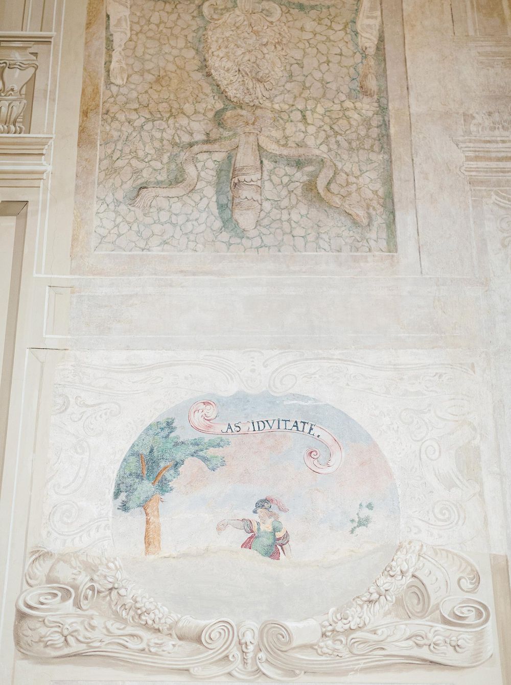 An artistic portrayal of a man on the historic wall of Lobkowicz palace in Prague.