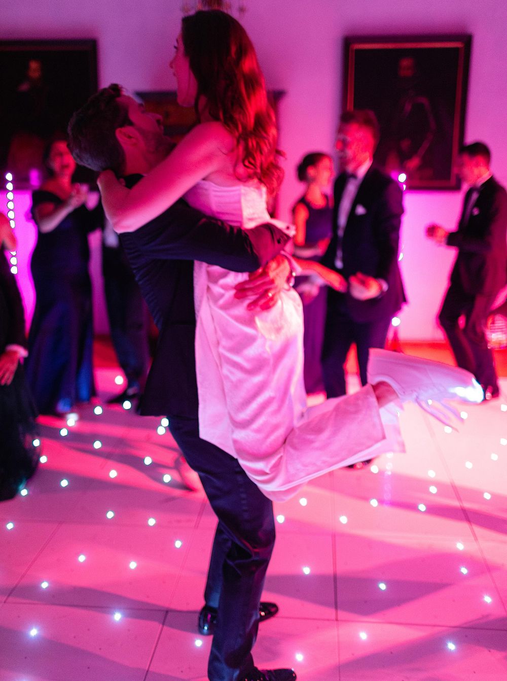 Romantic wedding dance in Lobkowicz Palace, Prague - couple dancing gracefully in a stunning, historic ballroom.