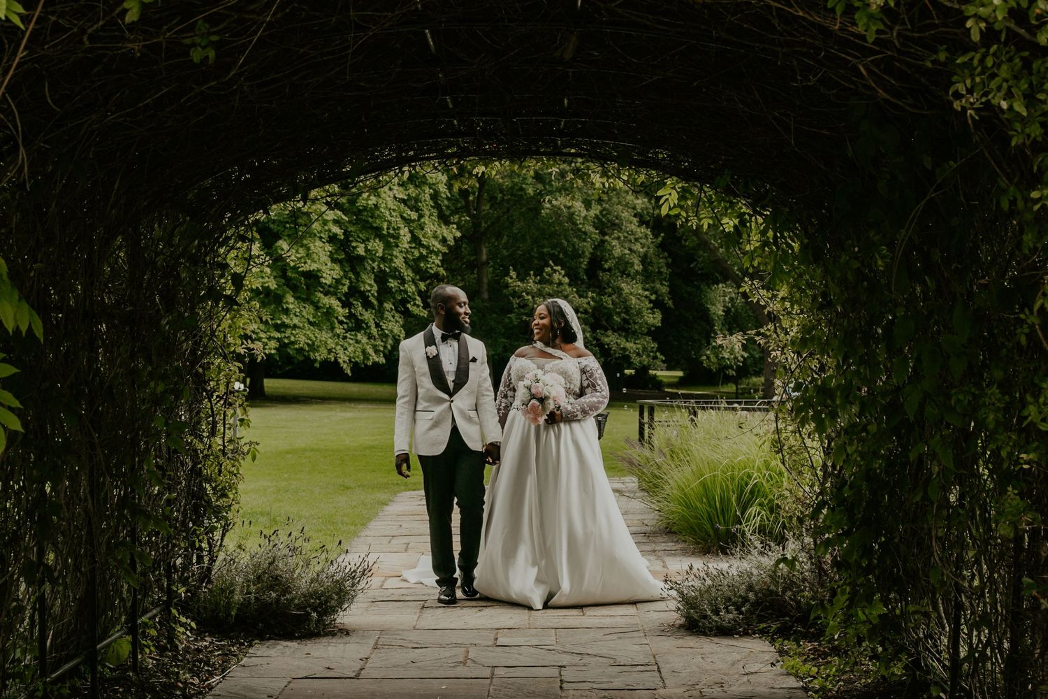 Bride and Groom under arch, Sopwell House Wedding St Albans