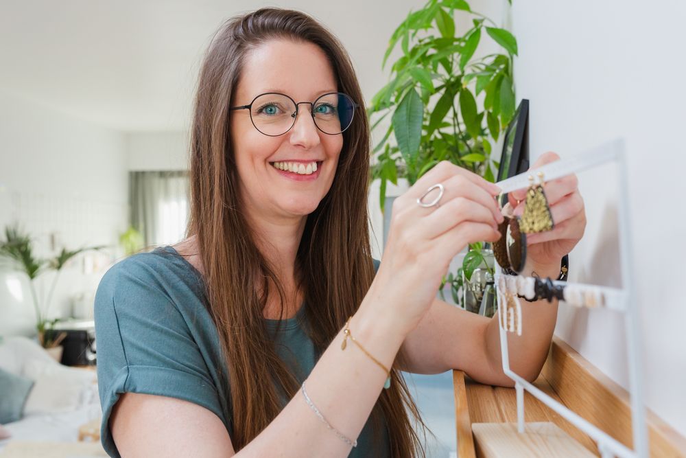Working with a manual pasta maker to create homemade noodles in a bright home kitchen.
