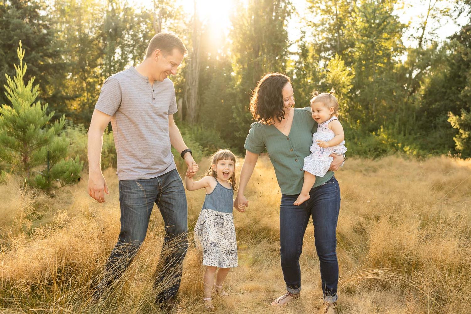 Family dancing at sunset.