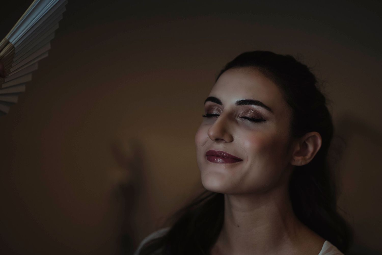 Atmospheric portrait with warm lighting and soft shadows.