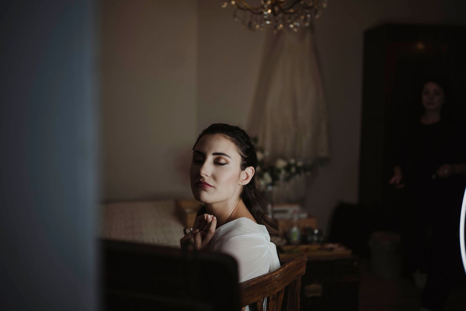 Artistic portrait in soft lighting with vintage interior elements.