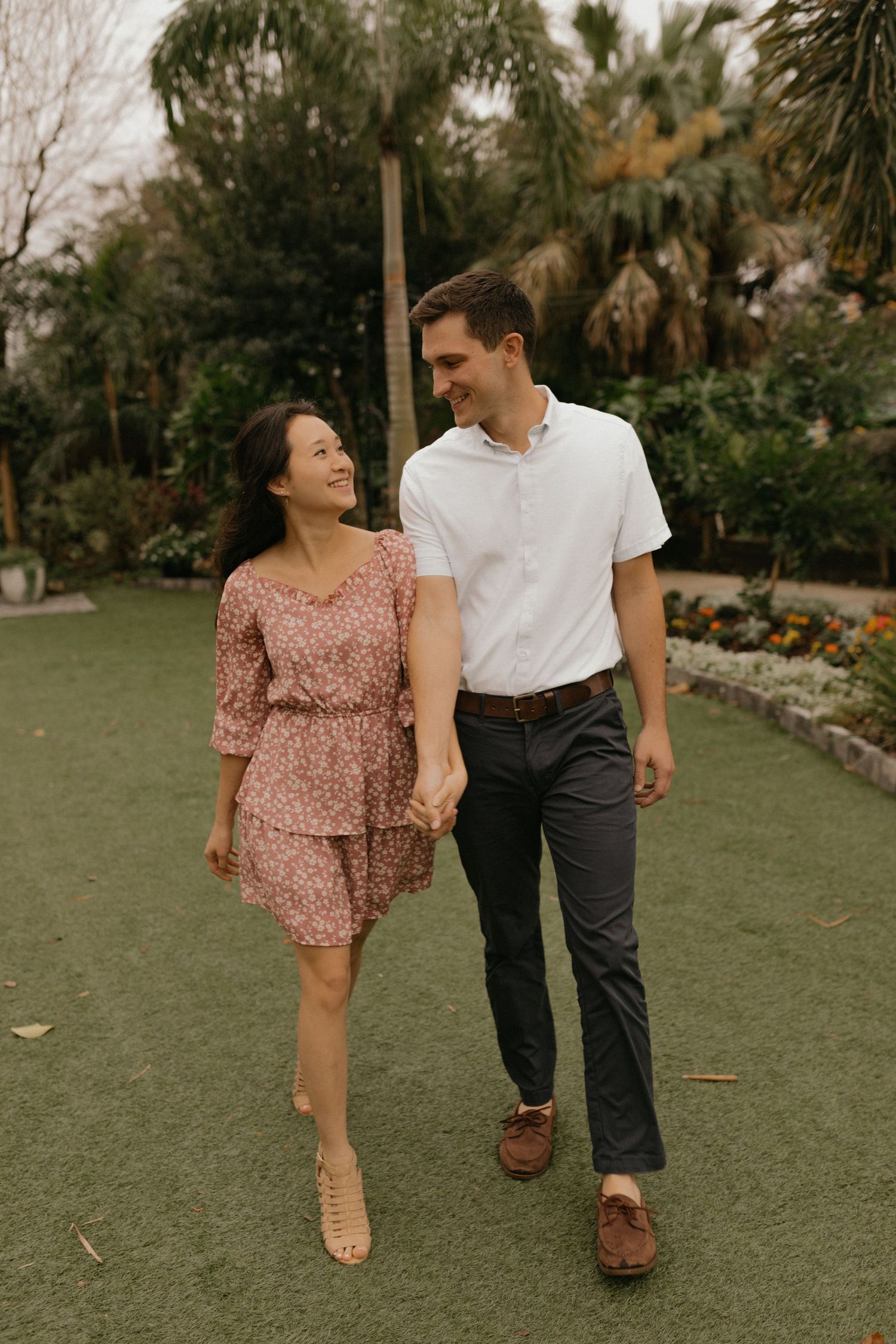 Orlando luxury wedding photographer a couple tropical garden, wearing casual spring outfits.