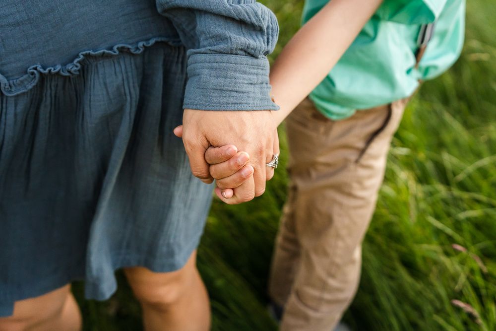 Family holding hands at sunset in Seattle