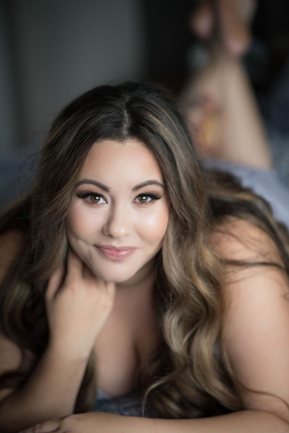 Boudoir photography session featuring soft lighting and natural expressions.