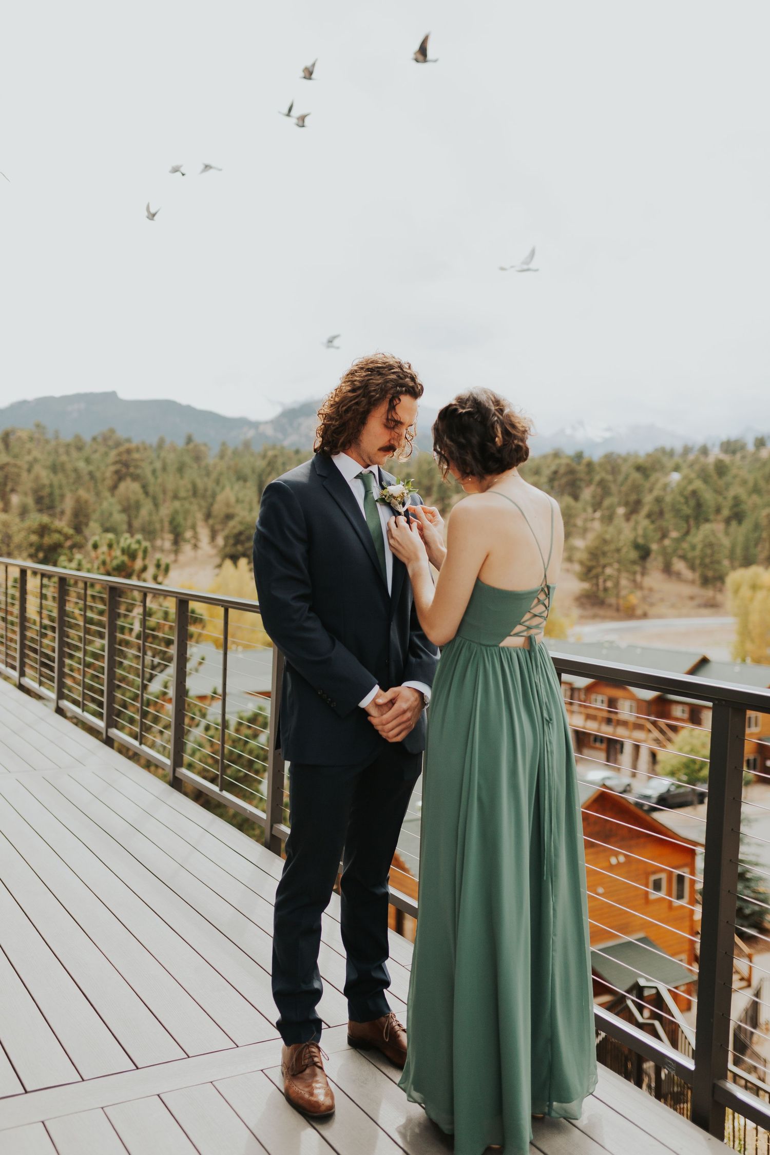 groom and sister with birds flying over