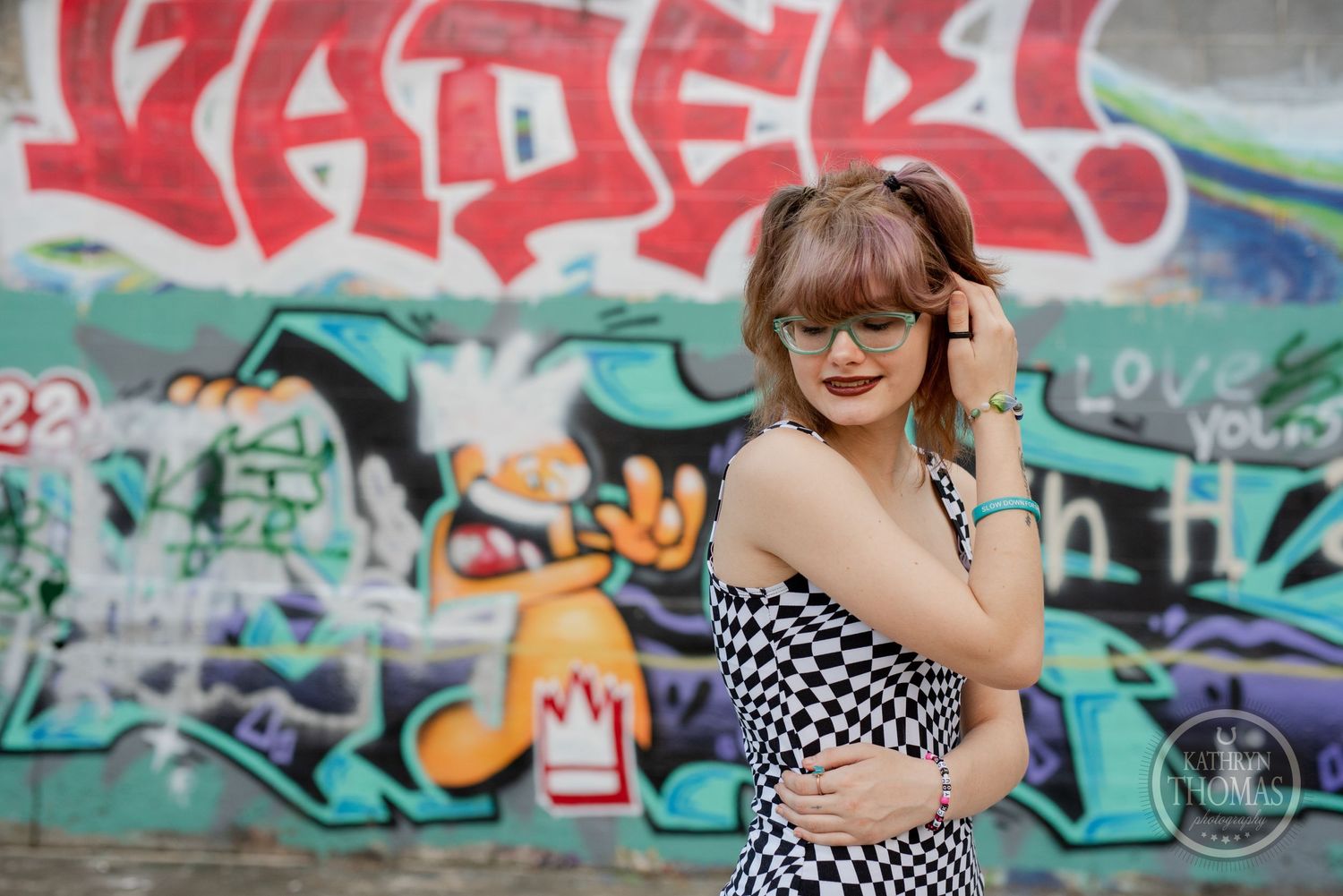 Street style portrait with urban graffiti elements and soft natural lighting.