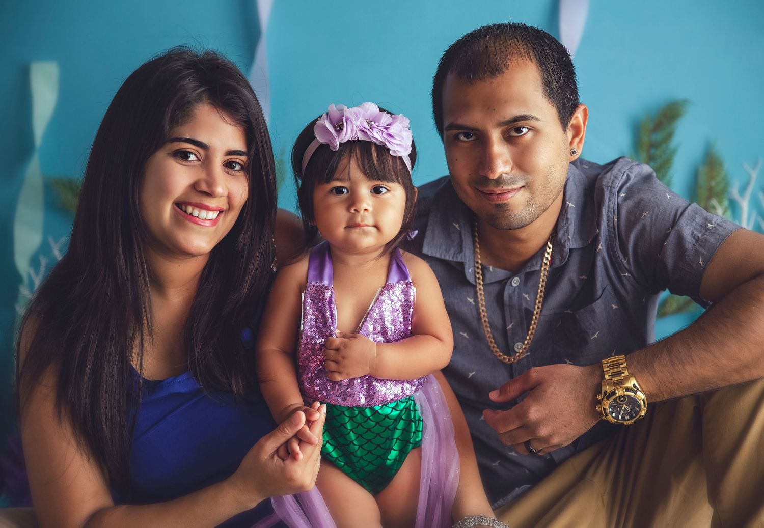 one year old session baby girl with parents mom and dad