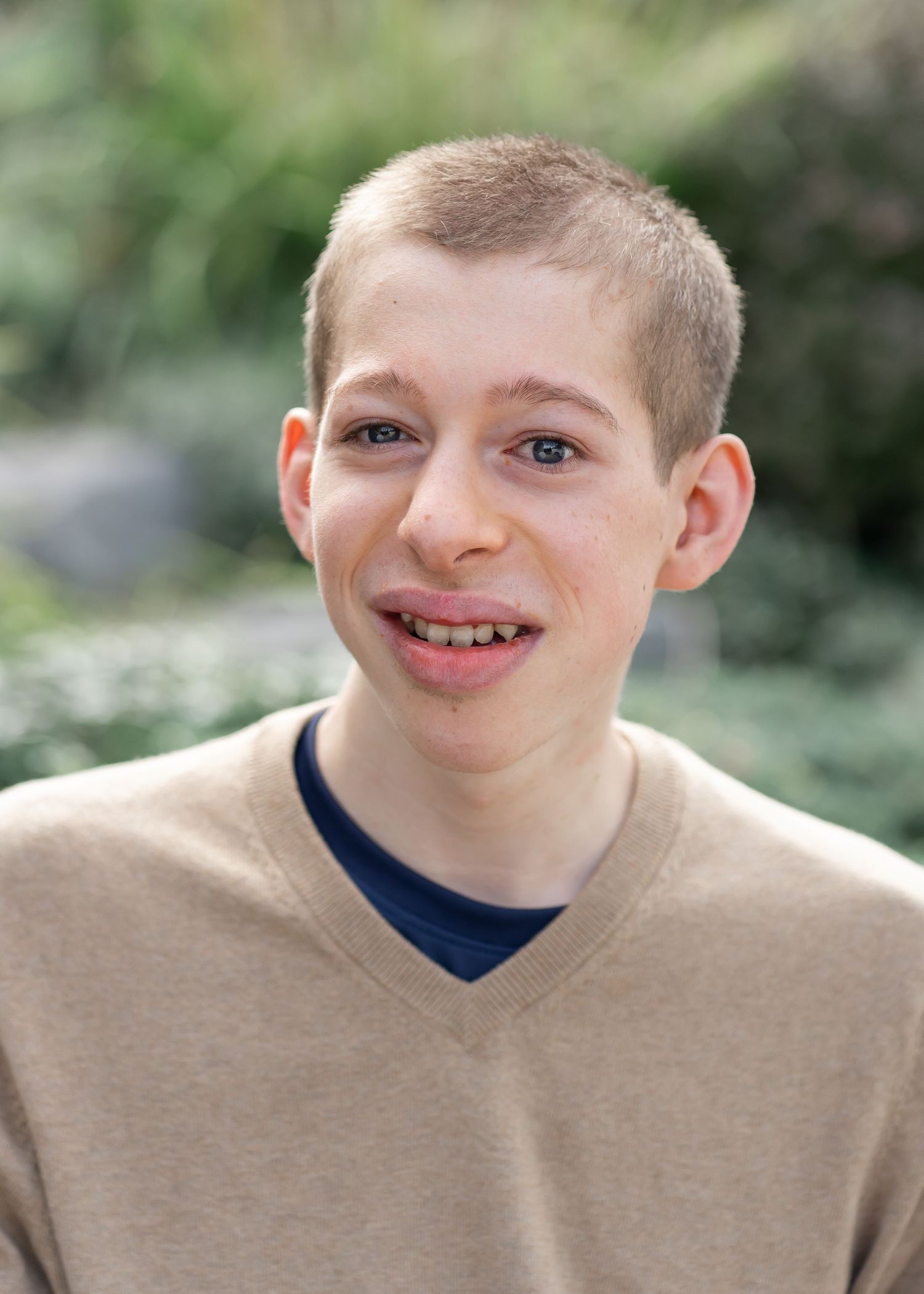 Young man smiles