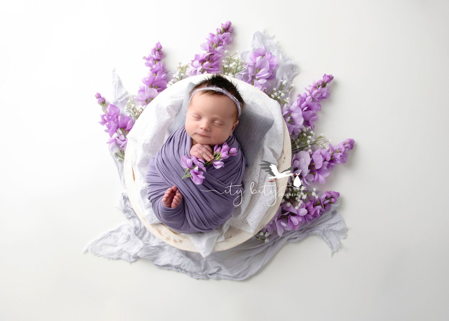 Westlake Newborn Baby Photographer | Baby Julia in purple floral wrapped set pictures