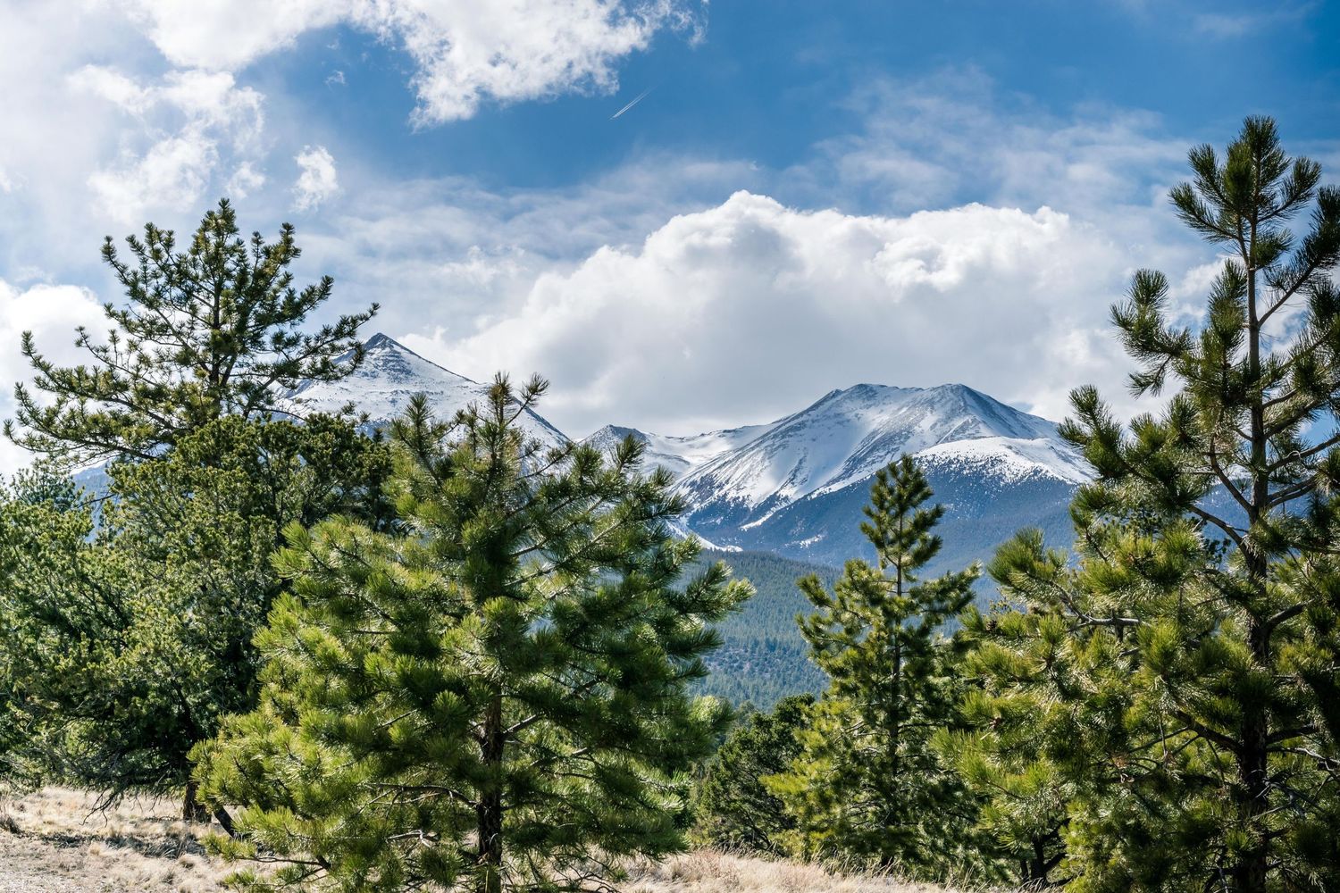 Image of snow caped mountains with blue sky at Salida, Colorado, USA