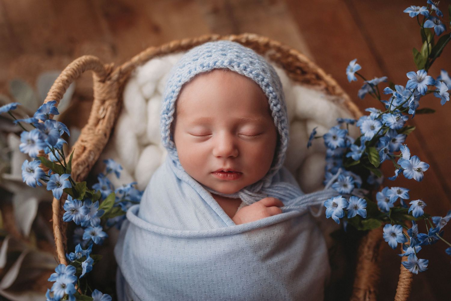 Tampa Newborn Photographer- Baby with blue bonnet with flowers