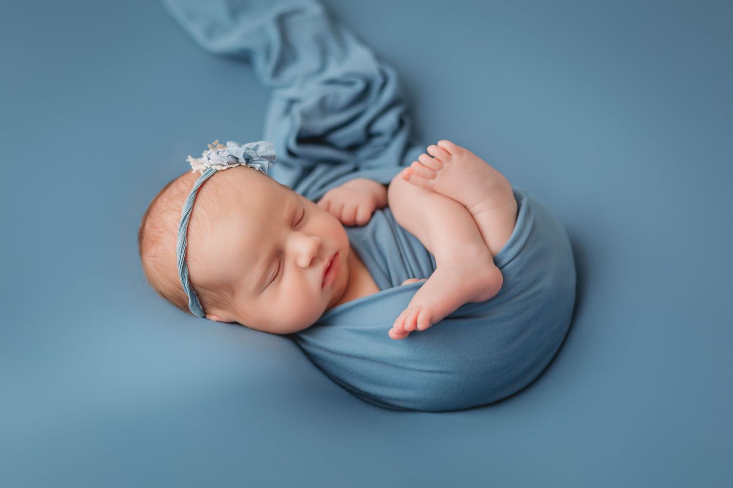 Tampa Newborn Photographer- Newborn baby with blue wrap