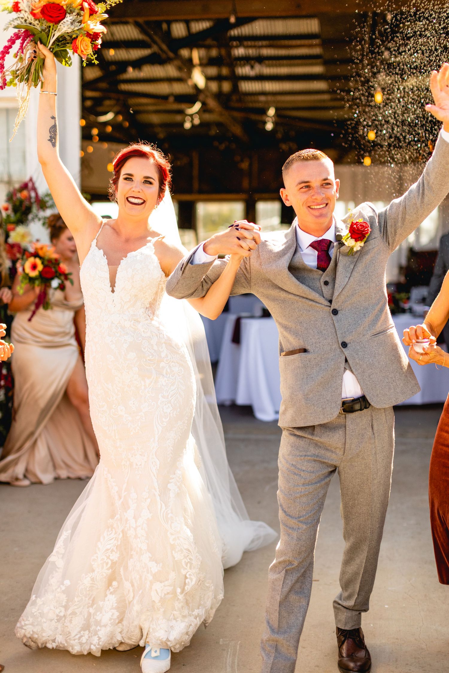 Newlyweds celebrating joyfully at their wedding reception.