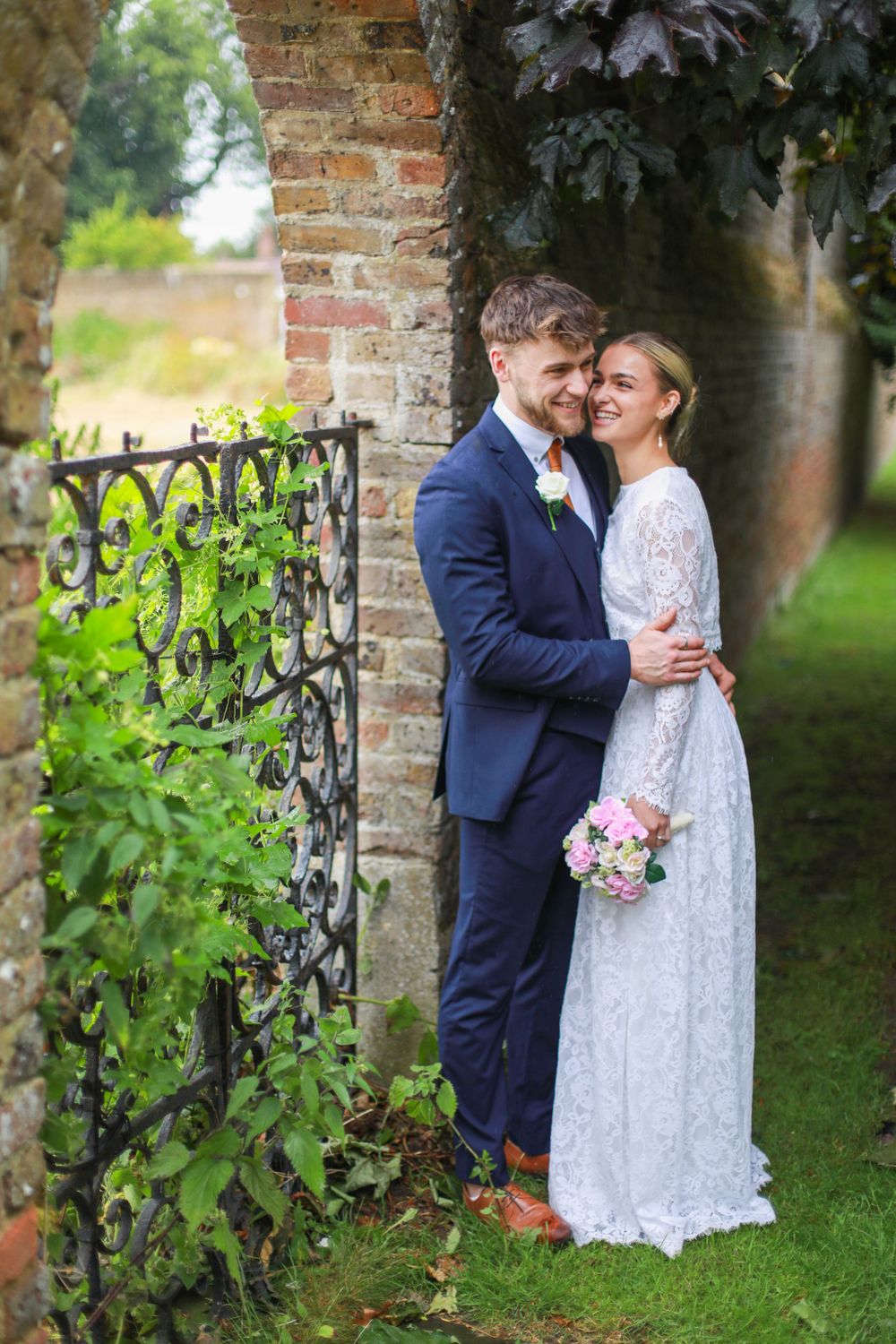 Candid photo of bride and groom at an outdoor wedding venue