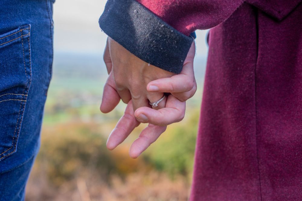 Close up of couple holding hands