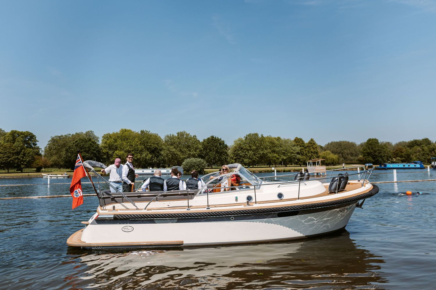Pleasure boat on Thames ferrying Groom and Groomsmen from Groom Prep to wedding venue Henley on Thames Remenham Court