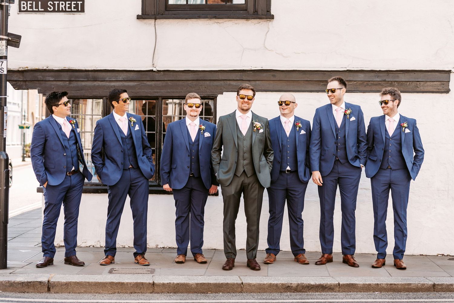 Groom and Grooms men lined up in street