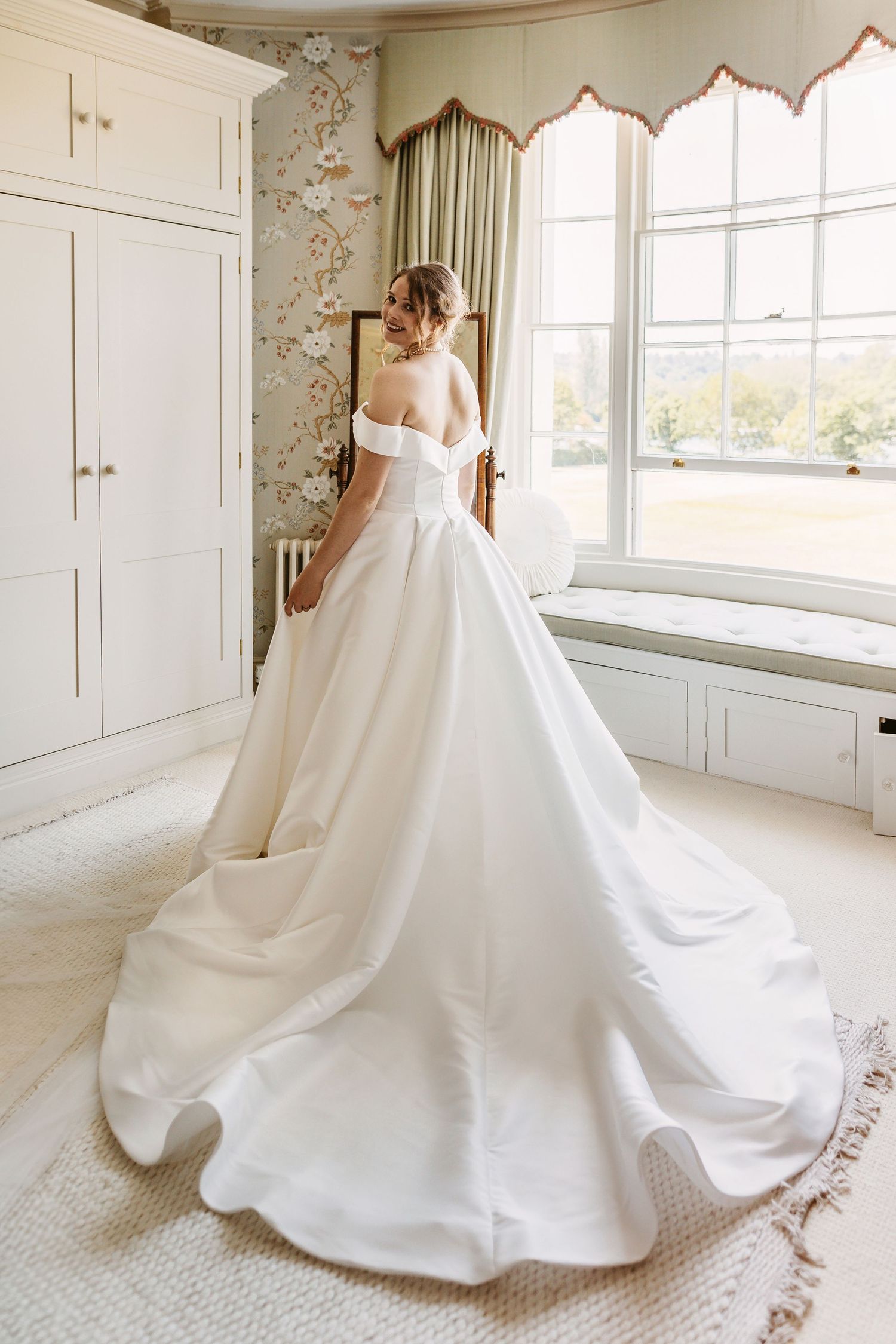 Beautiful bride wearing a stunning wedding dress ready for her ceremony at Remenham Court
