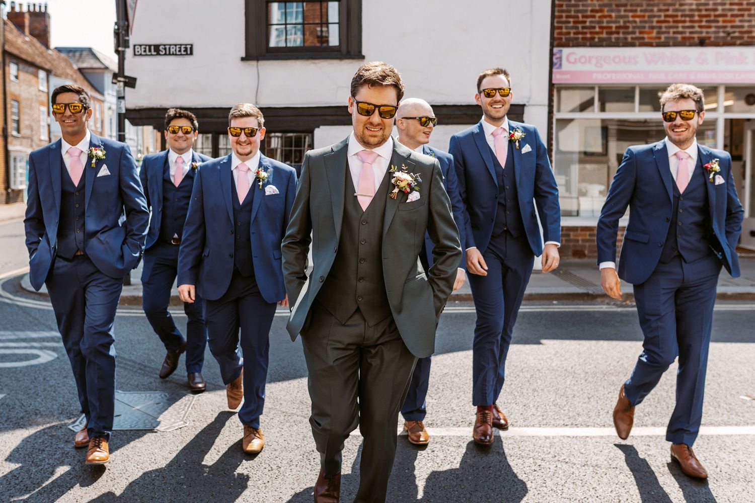 Groom and Grooms men crossing the street