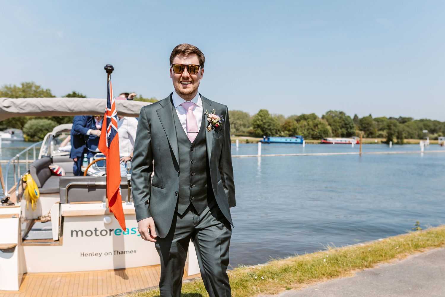 Pleasure boat on Thames ferrying Groom and Groomsmen from Groom Prep to wedding venue Henley on Thames Remenham Court