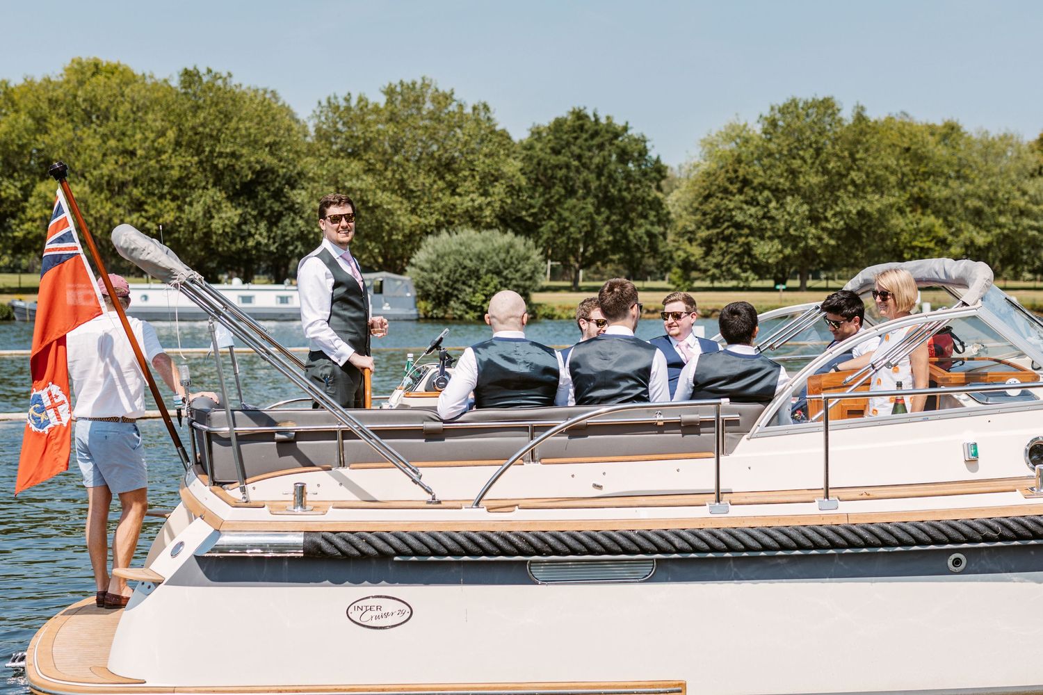 Pleasure boat on Thames ferrying Groom and Groomsmen from Groom Prep to wedding venue Henley on Thames Remenham Court