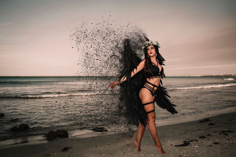 Silhouette sequence of a dancer twirling against a dramatic beach sunset backdrop.