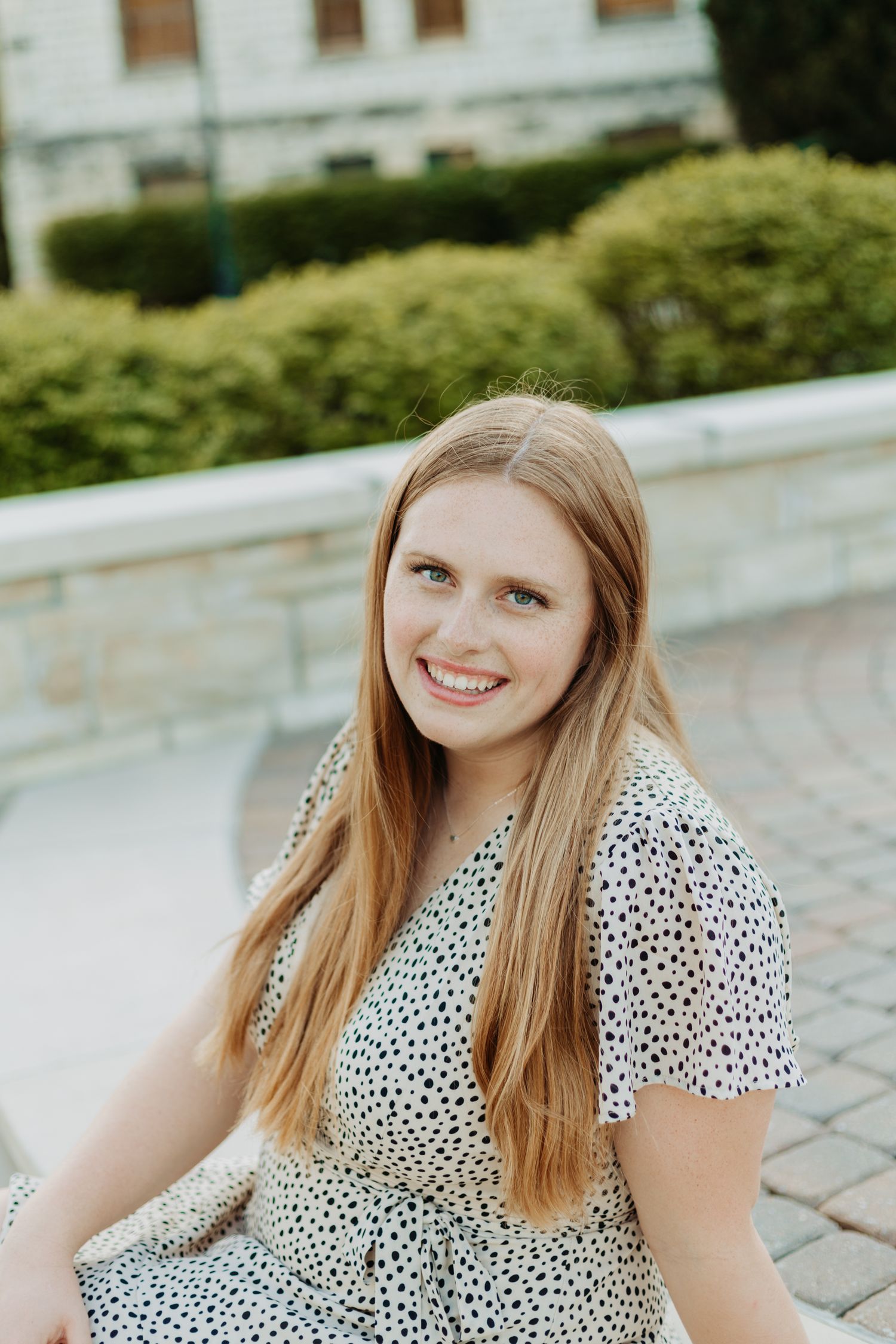 Senior photos in Manhattan, Kansas by portrait photographer – golden hour outdoor session with natural, candid senior portraits.