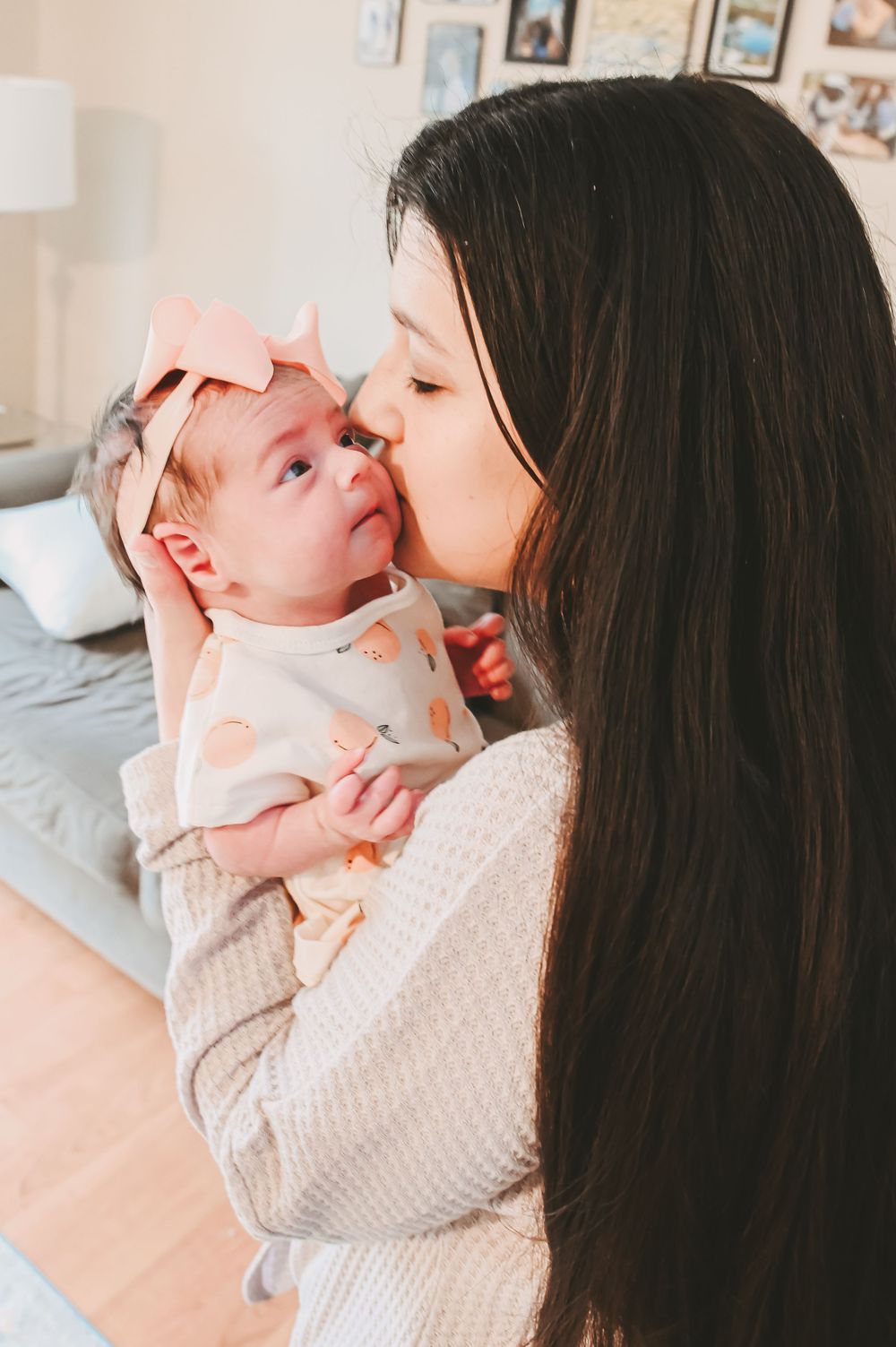 Close-up series of tender moments between parent and baby in soft natural light.