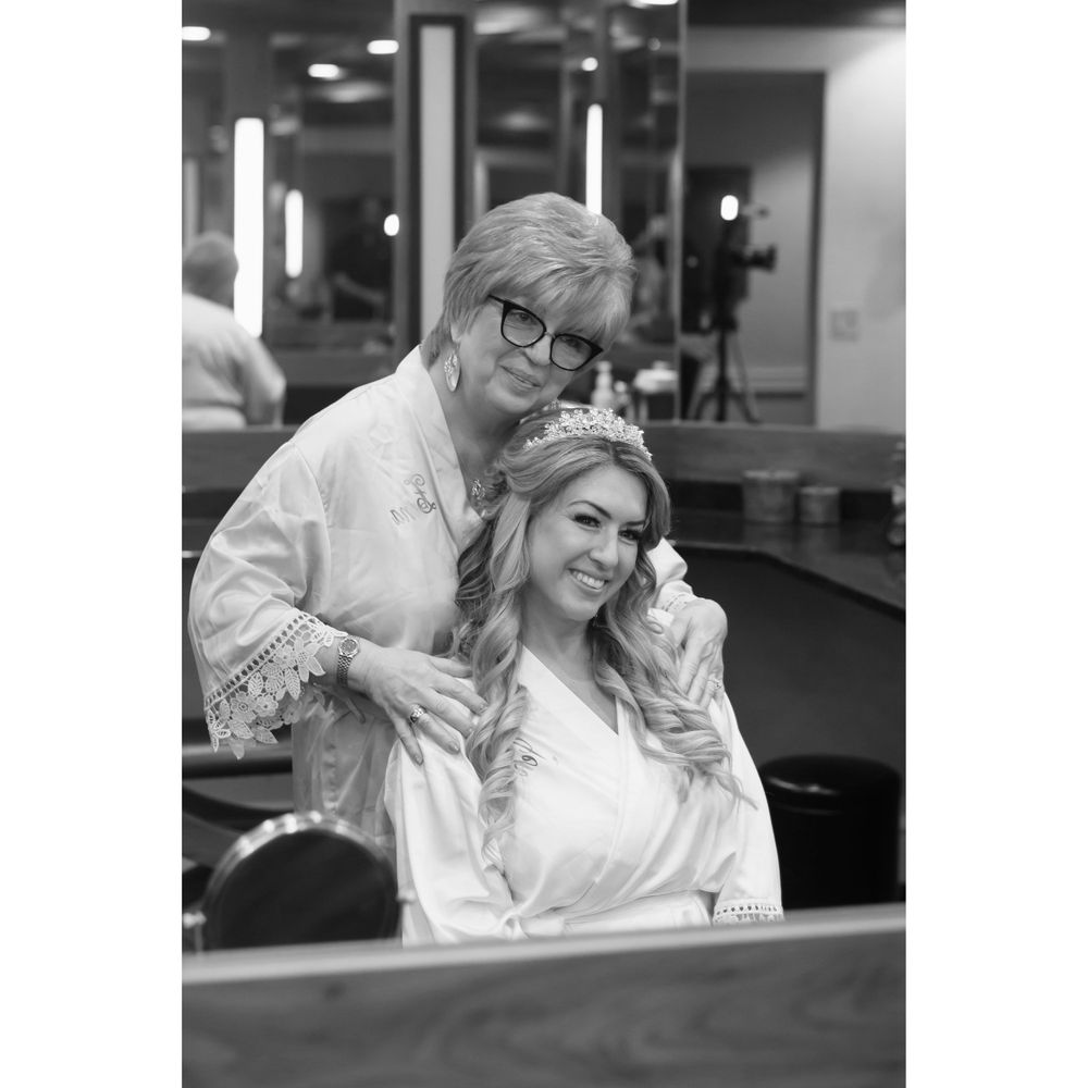 Bride and mother on wedding day at Firestone Country Club photographed by Tom Forrest.