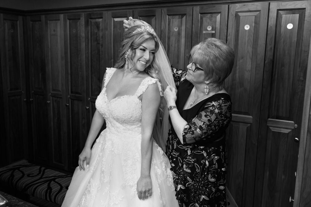 Bride gets ready for wedding at Firestone Country Club photographed by Tom Forrest.