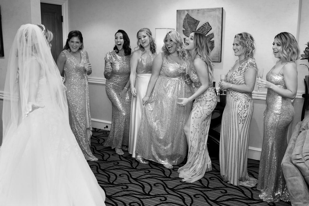 Bridesmaids first look at Firestone Country Club photographed by Tom Forrest.