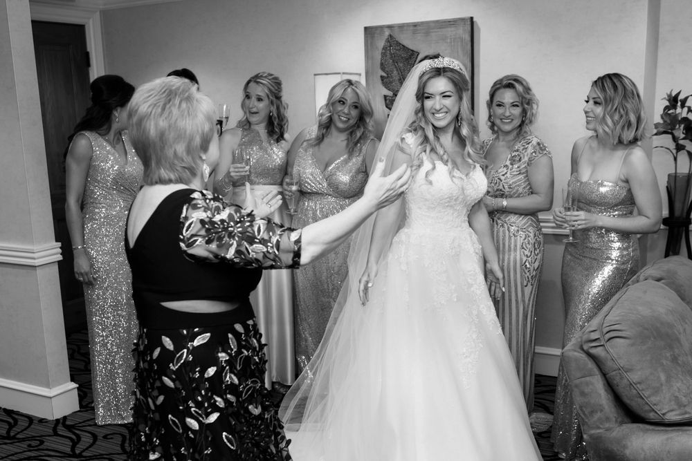 Bridesmaids, bride and mother at Firestone Country Club photographed by Tom Forrest.