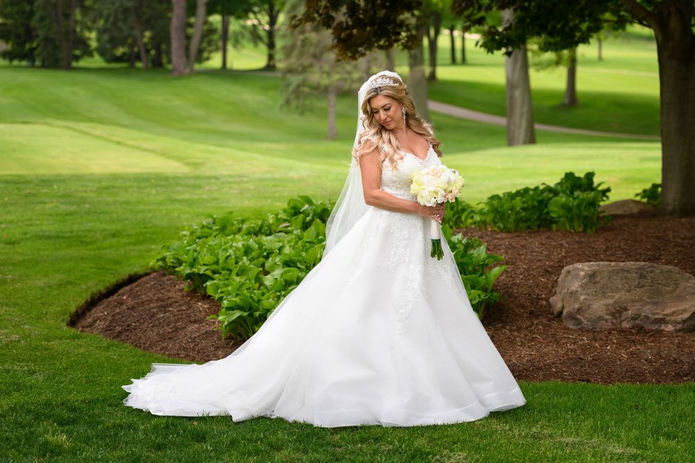Bridal portrait on wedding day at Firestone Country Club photographed by Tom Forrest.