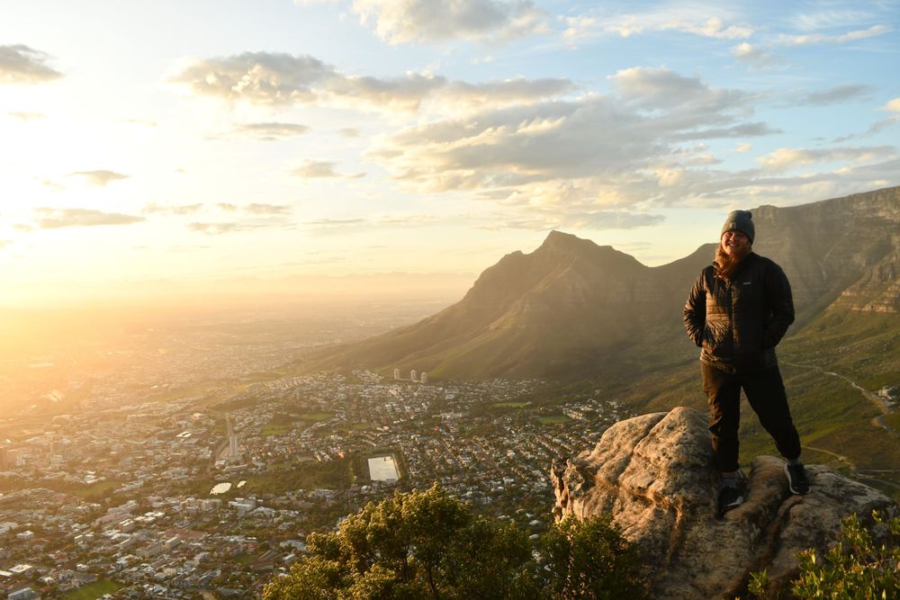 Smiling girl on top of mountain in South Africa in Cape Town, storytelling, photographer, adventure, photographer