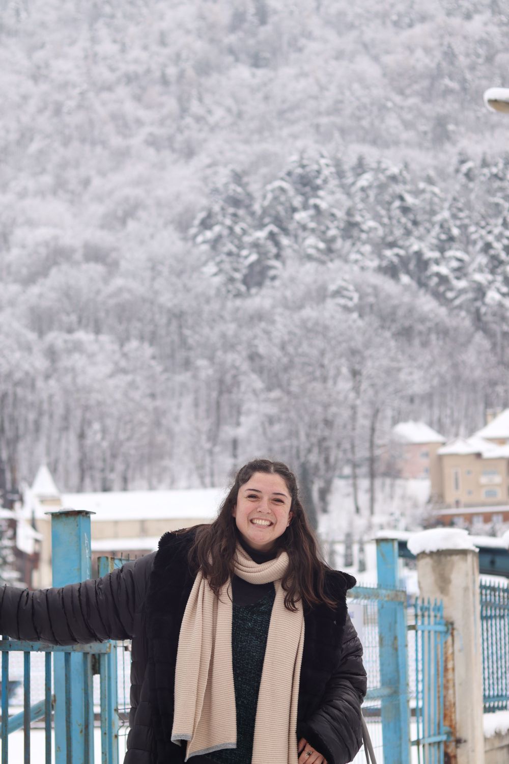 Portrait of a girl smiling in Romania in winter adventure, cinematic storytelling photographer