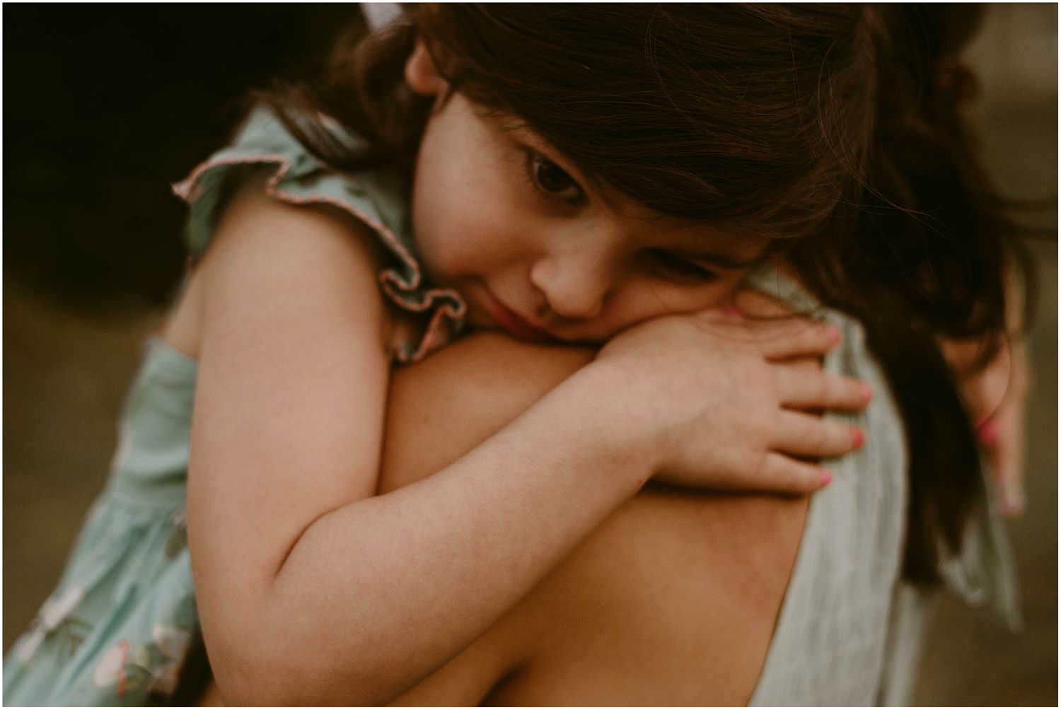An intimate embrace captured in warm golden light showing pure affection and love.