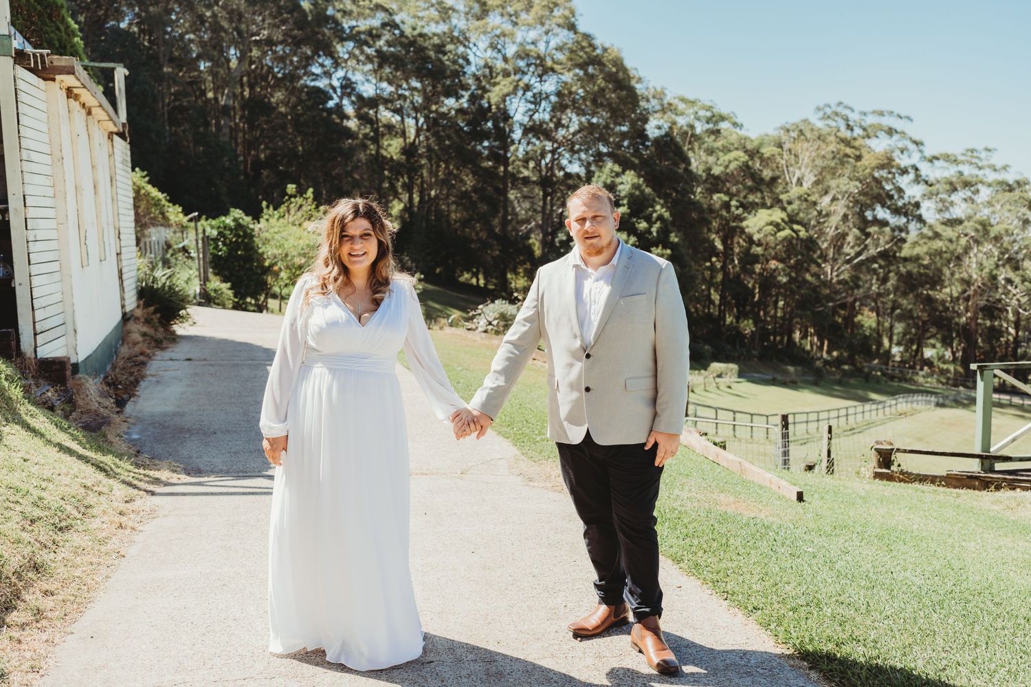 Bride and Groom Holding Hands at Central Coast Wedding during bridal portraits
