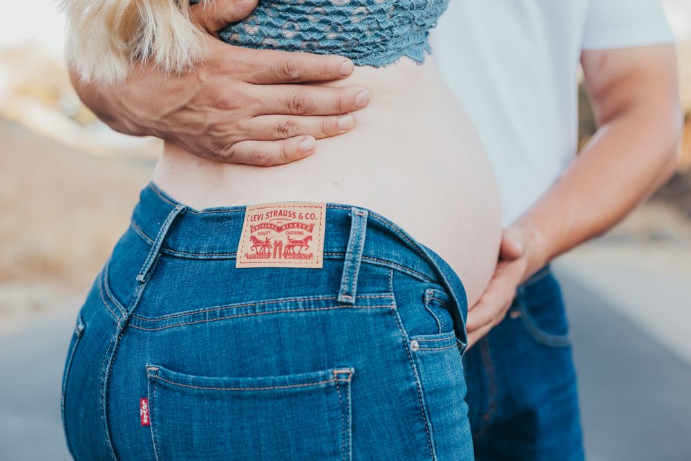 secret baby name reveal, mom and dad, family of four