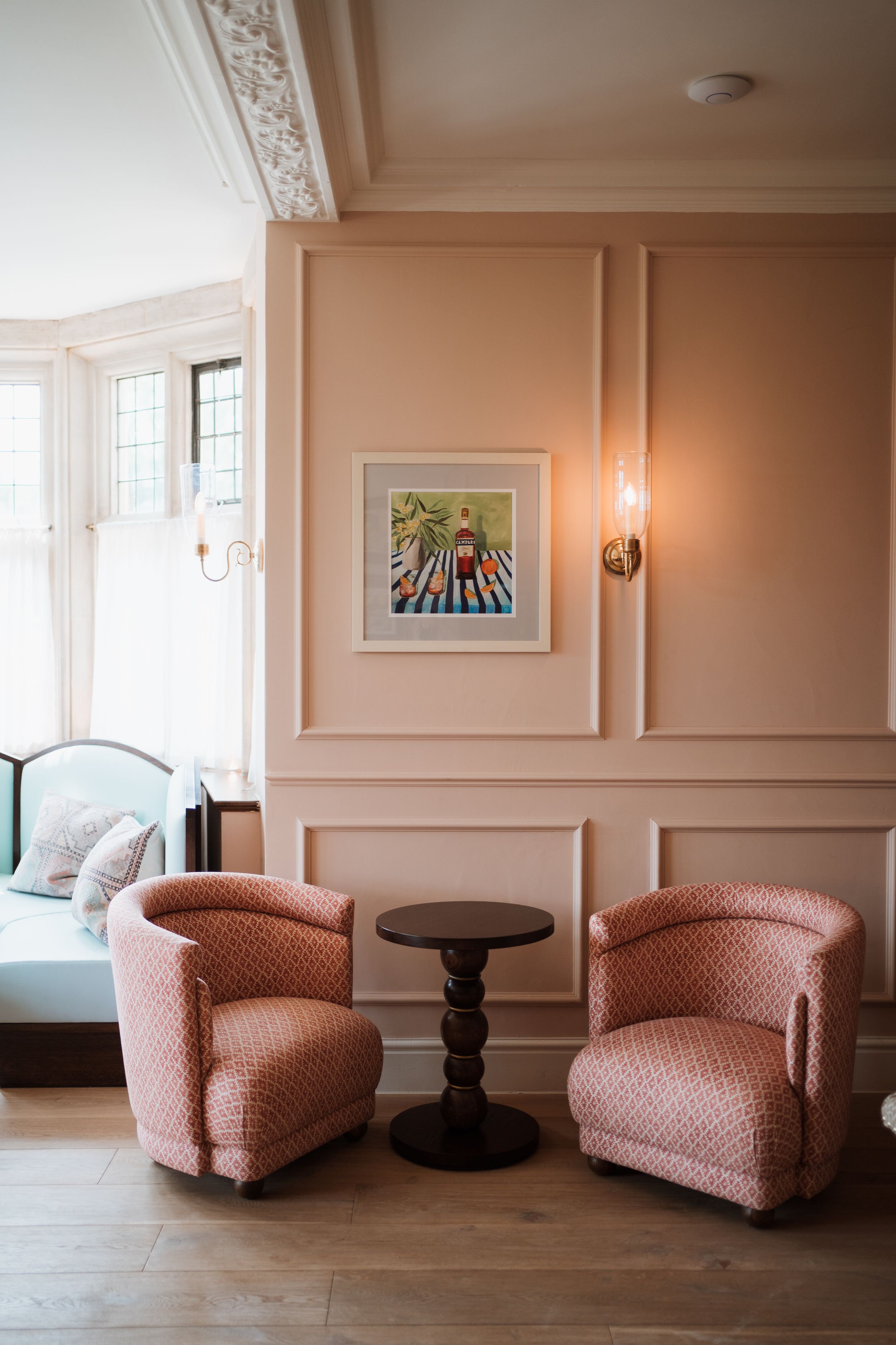 two pink sofas and pink panelling at kin house