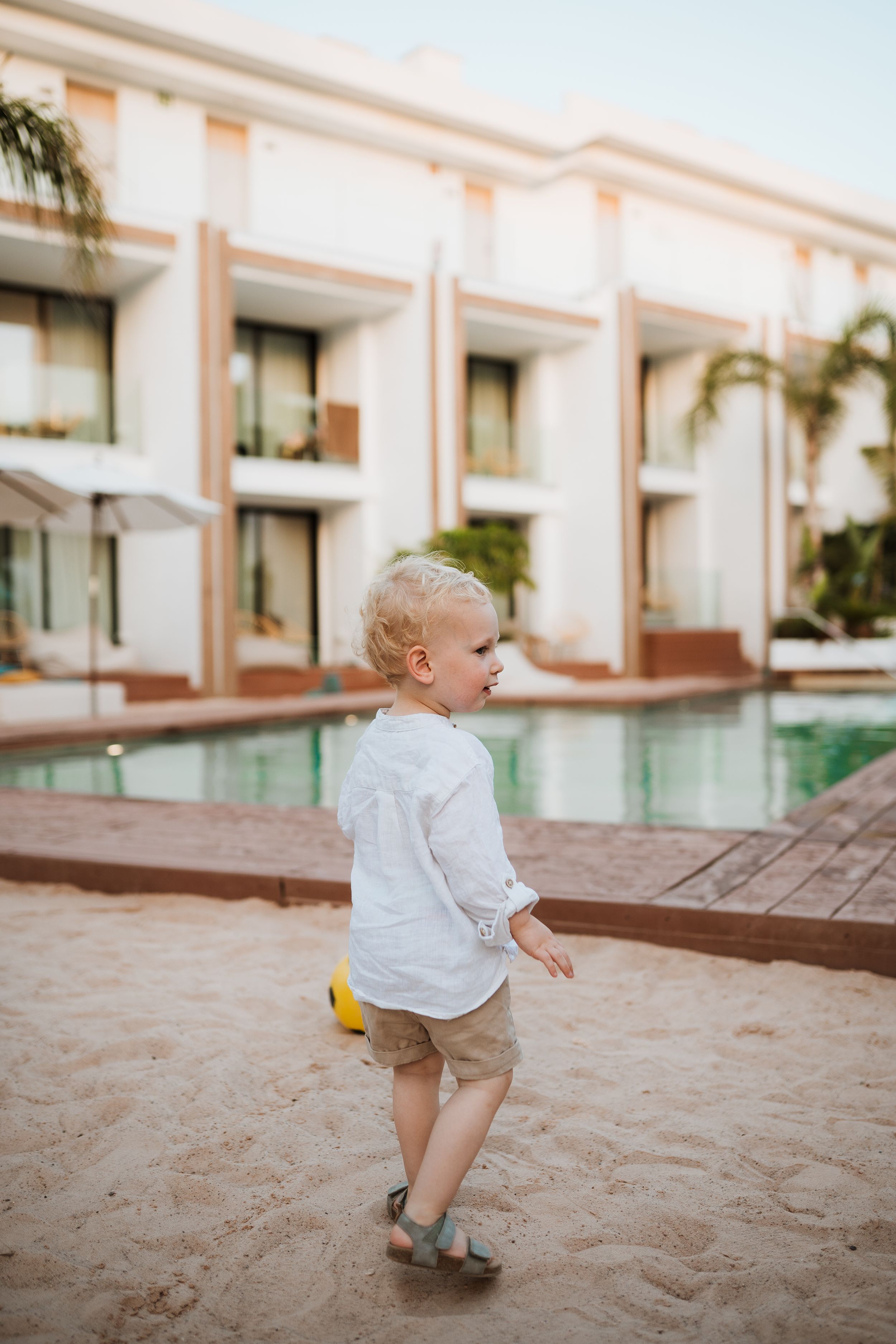 2 year old walking towards the pool at nativo, ibiza