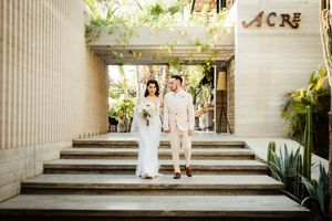 Wedding photography at a venue with elegant white columns and architectural details.