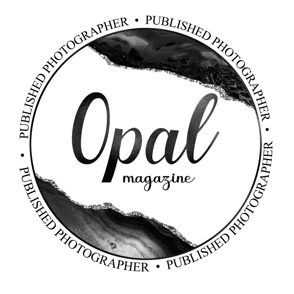 A badge from OPAL Magazine stating "Published Photographer" in black and white text, surrounding a gem stone logo.