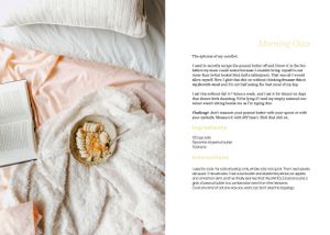 White textured bedding or linens with breakfast setup and recipe book pages.