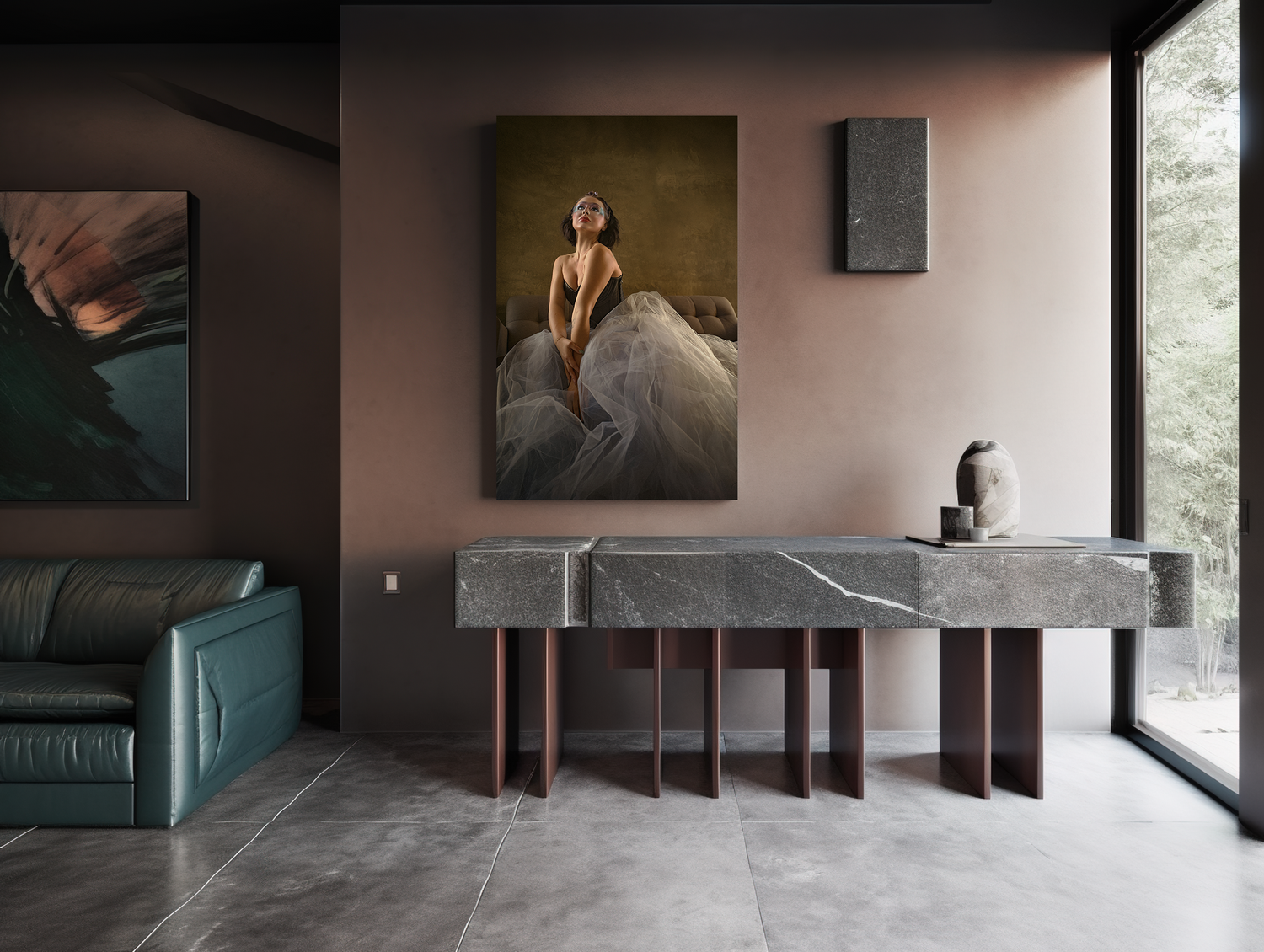 Modern interior featuring marble console table, leather sofa and large artwork on dusty rose wall.