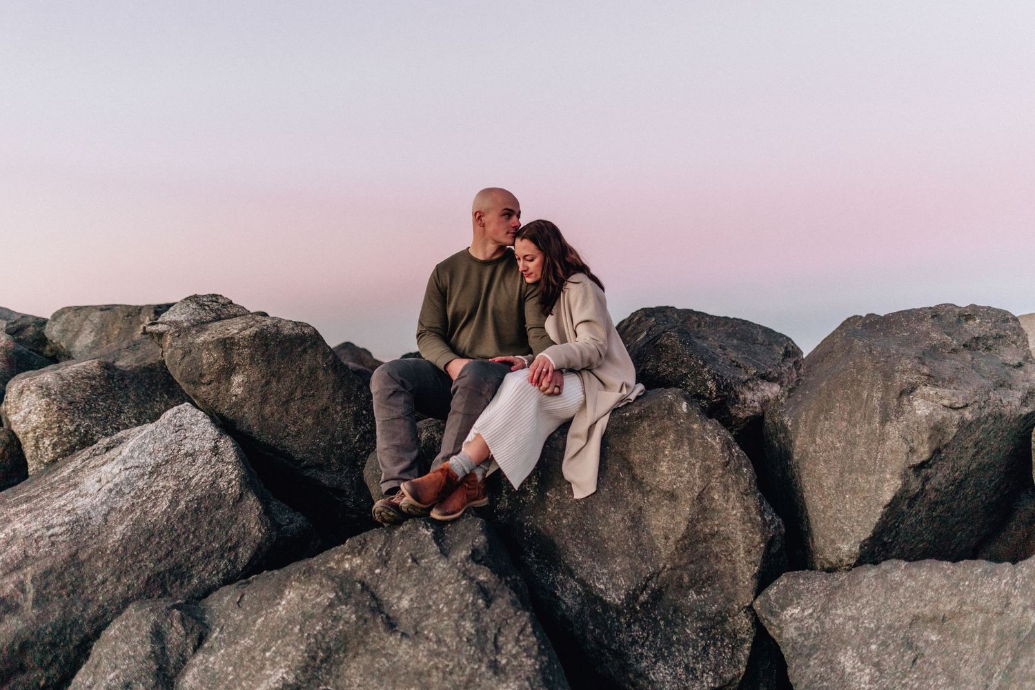micro wedding and elopment photography in virginia beach, virginia couple sitting on rocks