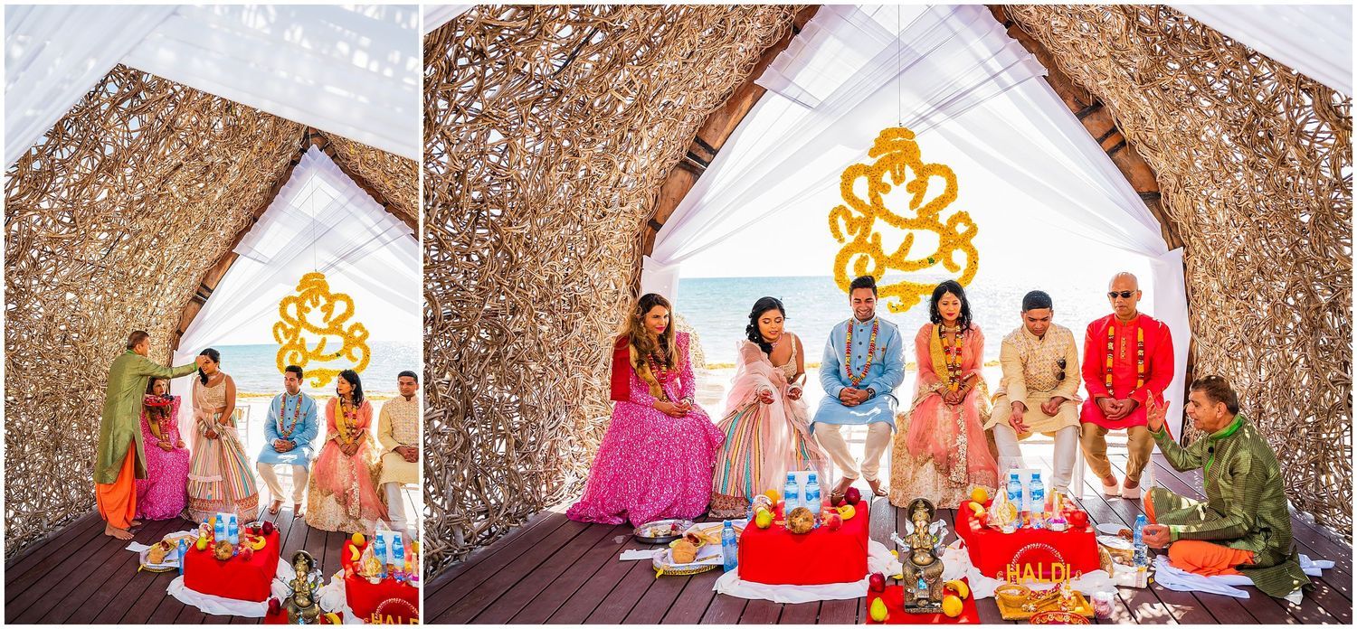 Wedding ceremony space decorated with traditional Indian elements and colorful attire.