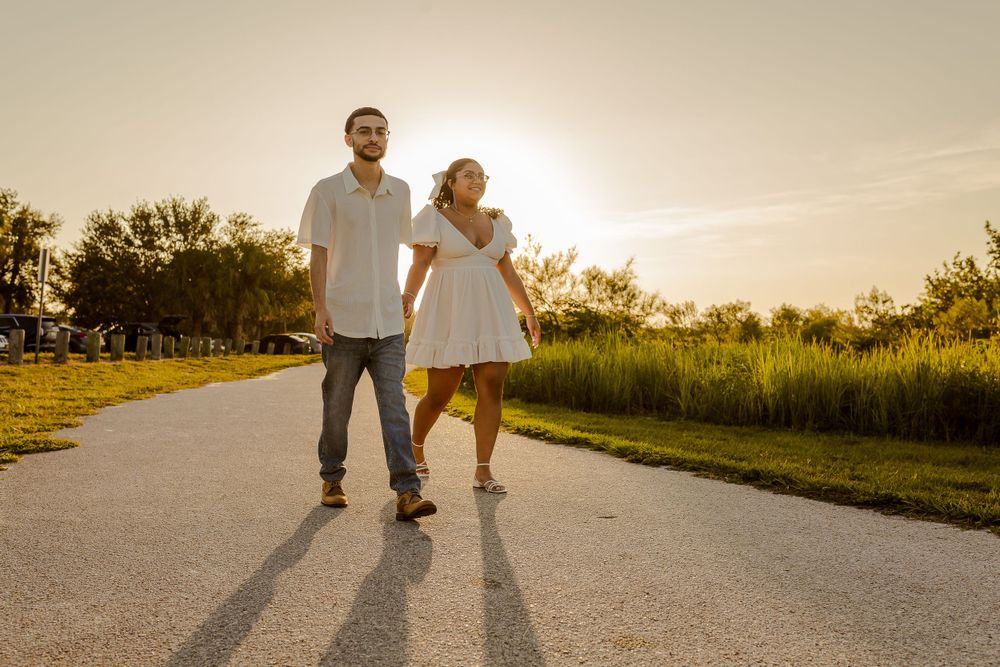 couples walking in the park at golden hour